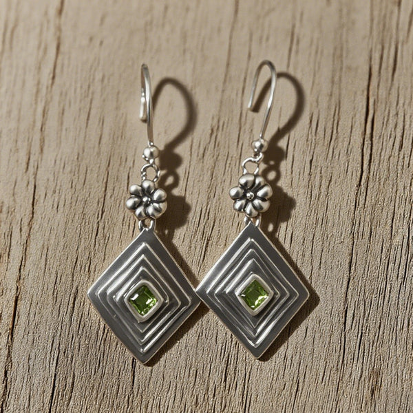 Elegant Silver Peridot Drop Earrings with Floral Design