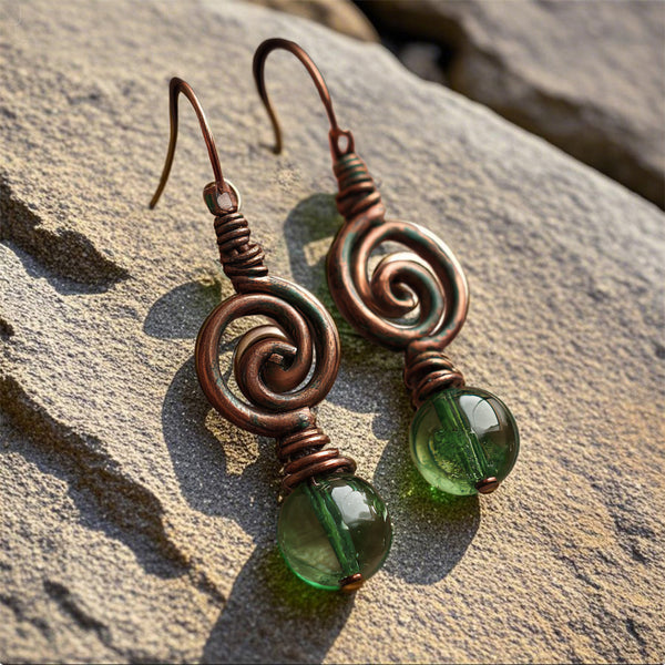 Handcrafted Copper Spiral Earrings with Green Glass Beads