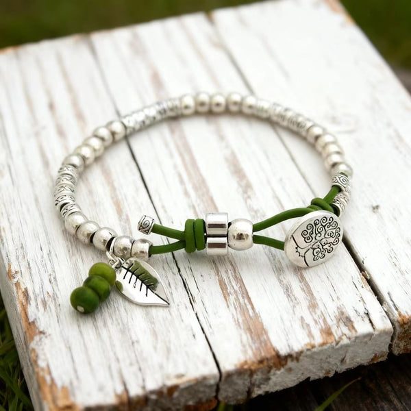 Handmade Bohemian Adjustable Silver Bracelet with Turquoise Beads and Nature - Inspired Charms